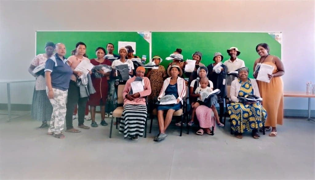 A community handover of packed goods